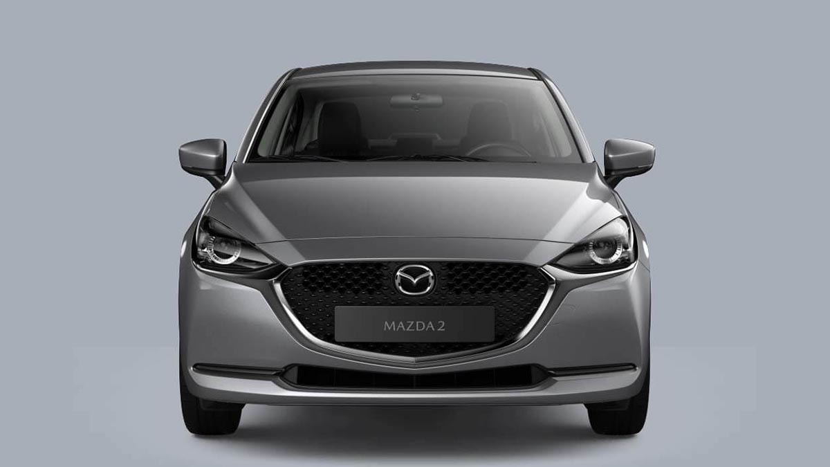  Vue avant du Mazda2 Hybrid avec sa calandre distinctive et ses phares LED affinés.