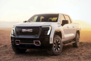 GMC AT4 électrifié avec équipement tout-terrain avancé sur un chemin de terre